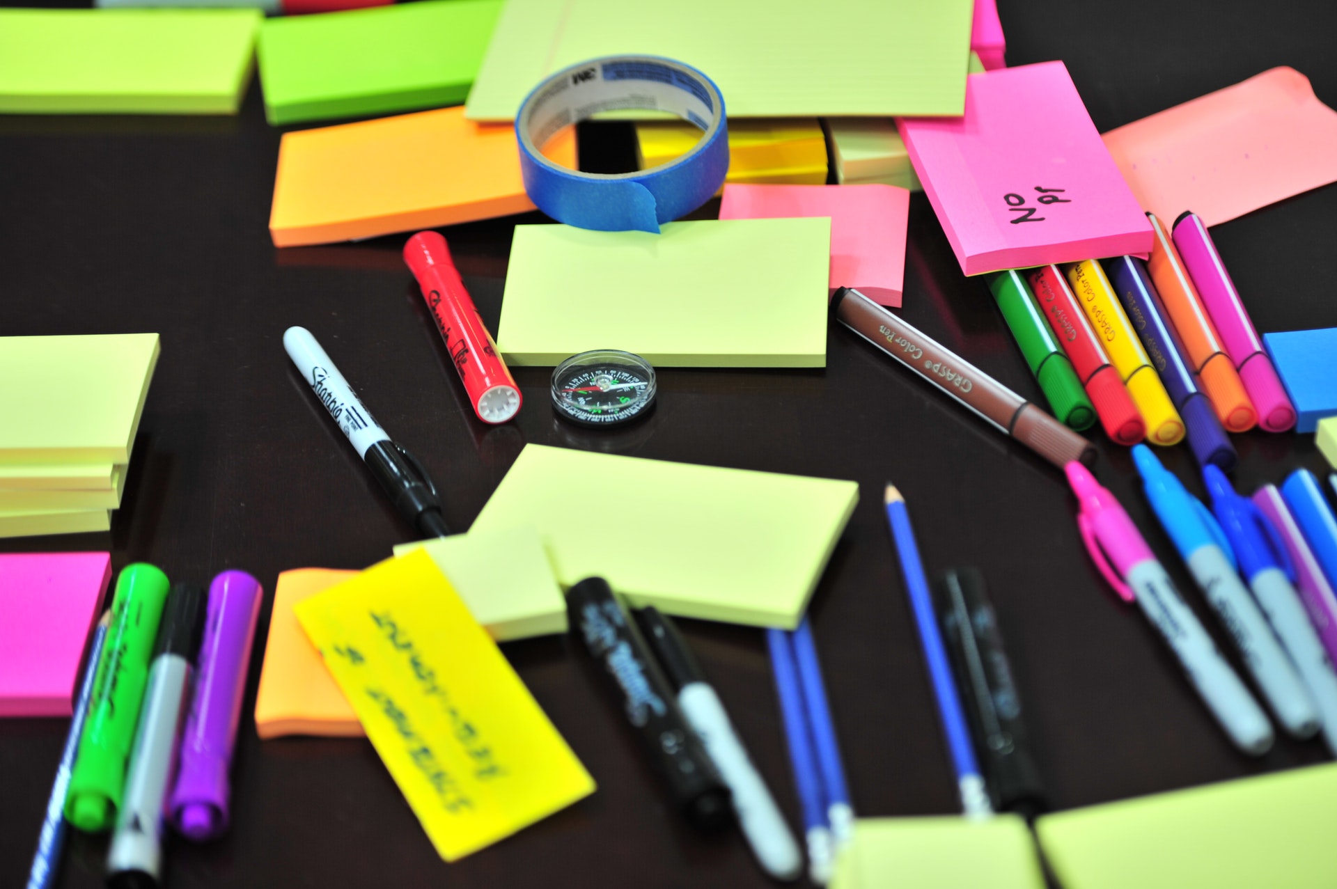 photo-of-sticky-notes-and-colored-pens-scrambled-on-table-632470